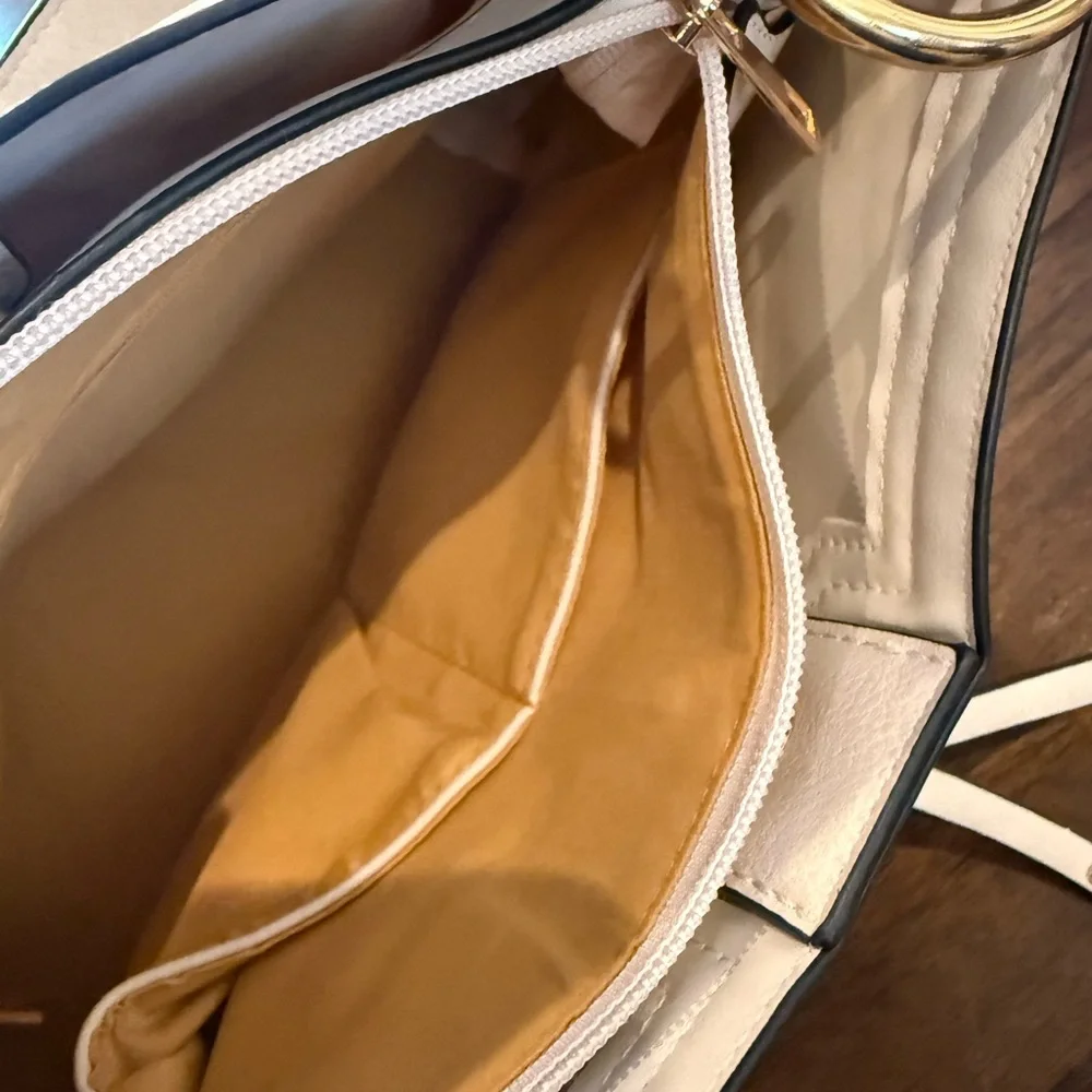 I Light colored faux leather hobo bag with gold-tone hardware like new condition